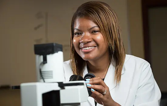 picture of Tanesha Norris in the lab who earned her biotech master's degree from UW-Madison