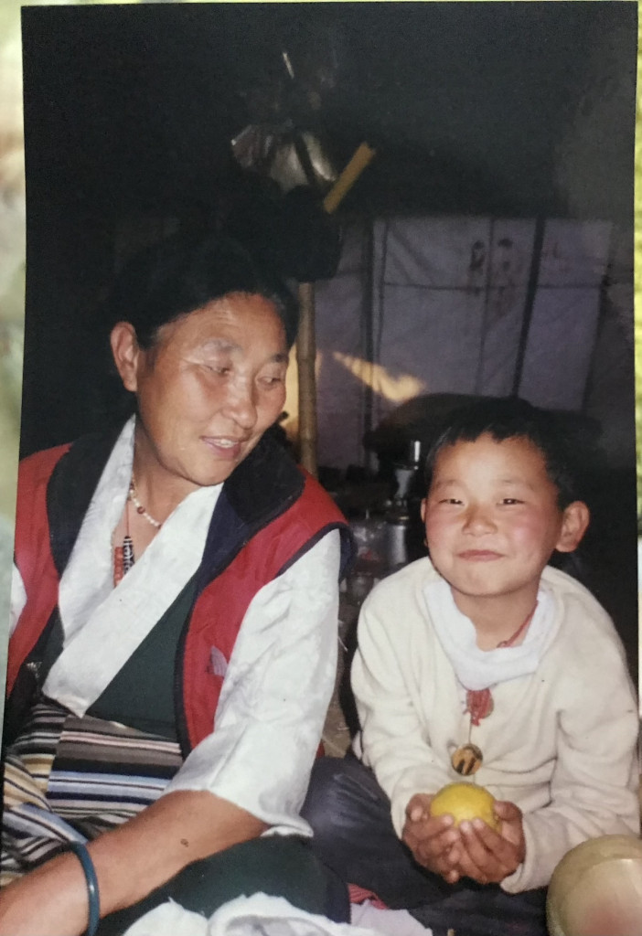 Photo of Tenzin and his mother Kunga Dolma when Tenzin was about 6 years old. They look happy.